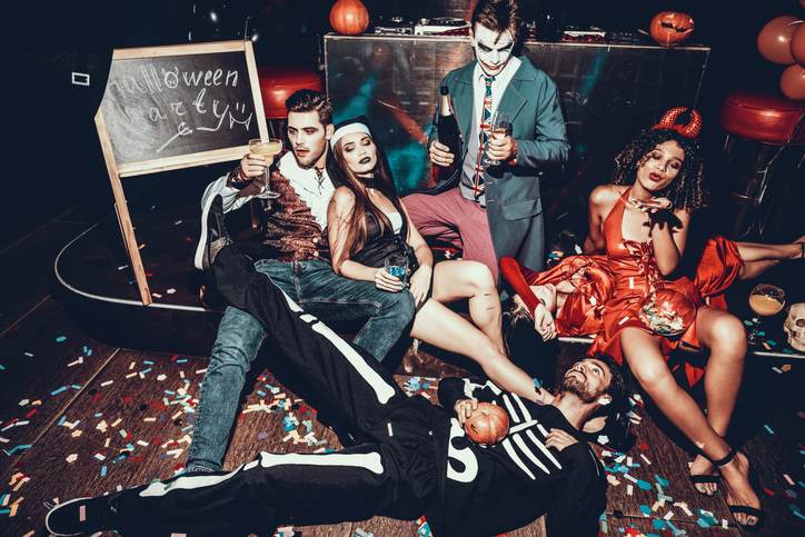 Drunk Young People in Costumes Resting after Party Drunk Young People in Costumes Resting after Party