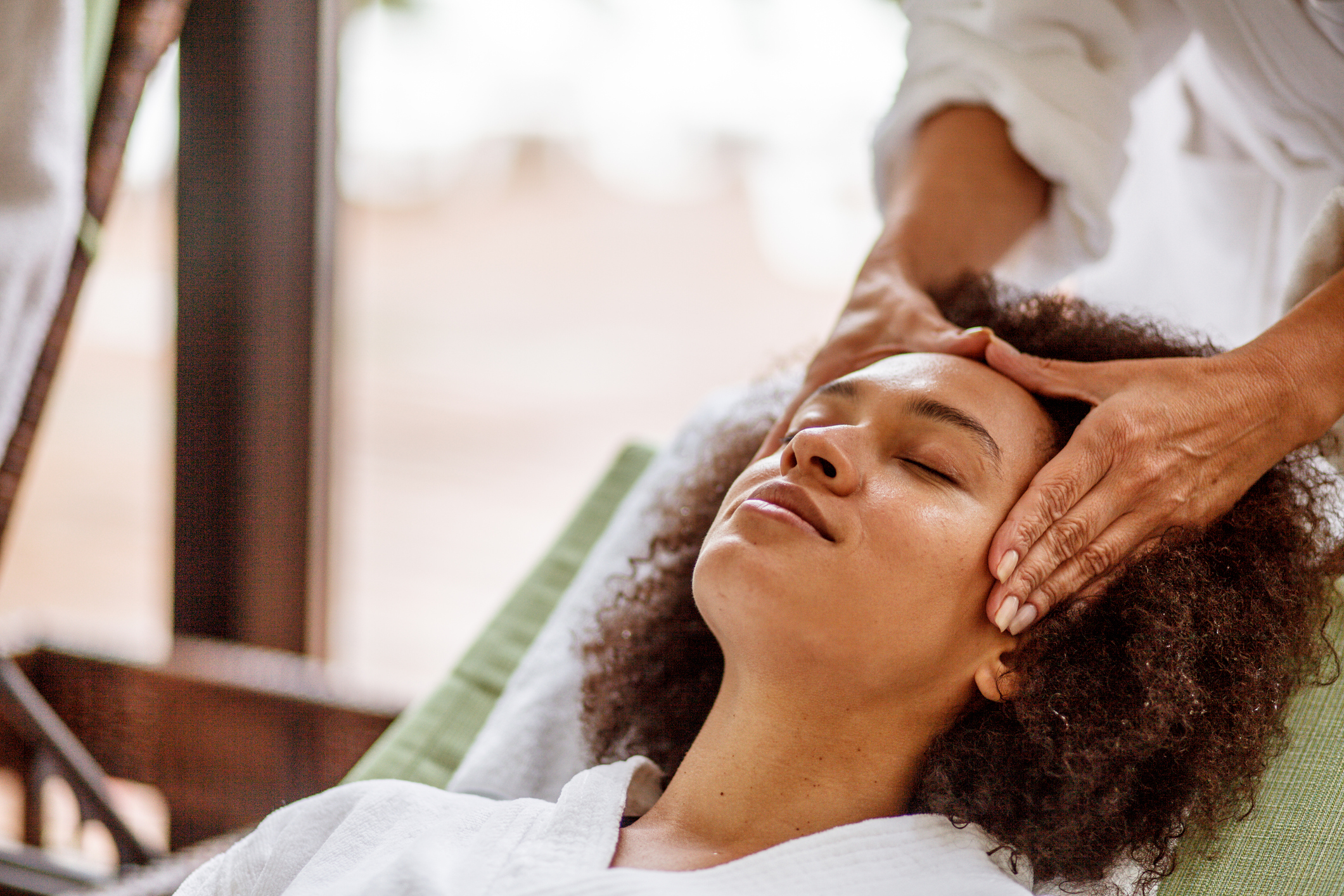 Woman relaxing during head massage